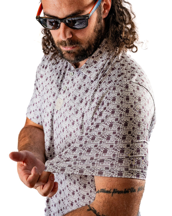 Men’s Retro Form golf polo by Pins & Aces featuring a vintage-inspired geometric print in neutral tones with burgundy accents, short sleeves, and an athletic fit.