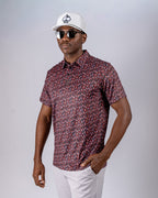 Men’s Shadow Rose golf polo by Pins & Aces featuring an all-over red and muted rose floral print on a black background with short sleeves and an athletic performance fit.