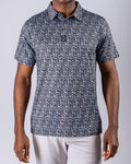 Men’s Shark Tooth golf polo by Pins & Aces featuring an all-over black, charcoal, gray, and white shark tooth-inspired micro print with short sleeves and an athletic performance fit.
