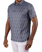 Men’s Shark Tooth golf polo by Pins & Aces featuring an all-over black, charcoal, gray, and white shark tooth-inspired micro print with short sleeves and an athletic performance fit.