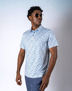 Pins & Aces Signal Boost men’s performance golf polo featuring an athletic fit with breathable fast-wicking fabric, SPF 45+ protection, and built-in sunglasses holder.