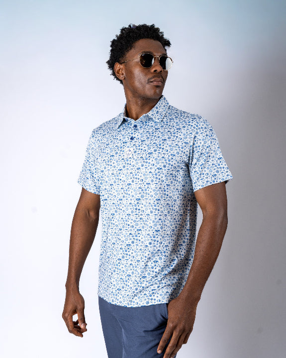 Pins & Aces Signal Boost men’s performance golf polo featuring an athletic fit with breathable fast-wicking fabric, SPF 45+ protection, and built-in sunglasses holder.