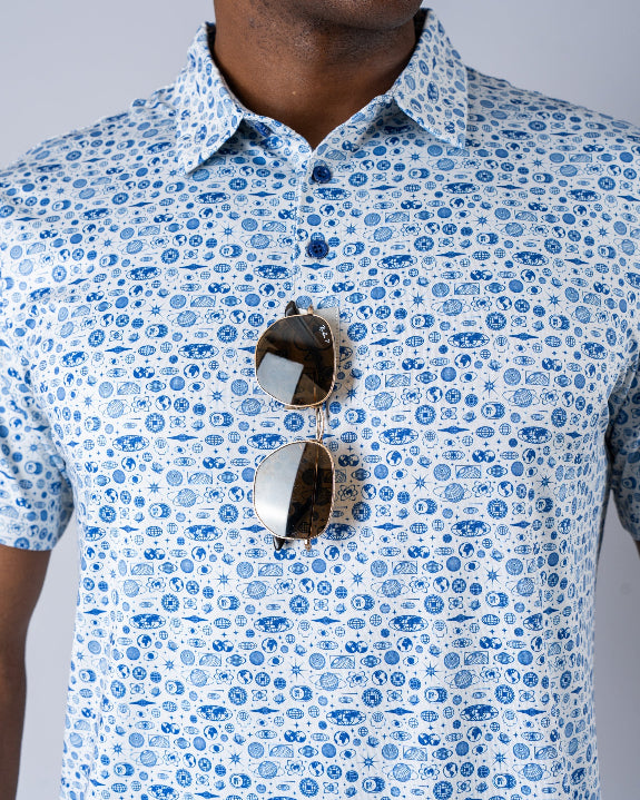 Pins & Aces Signal Boost men’s performance golf polo featuring an athletic fit with breathable fast-wicking fabric, SPF 45+ protection, and built-in sunglasses holder.