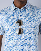 Pins & Aces Signal Boost men’s performance golf polo featuring an athletic fit with breathable fast-wicking fabric, SPF 45+ protection, and built-in sunglasses holder.