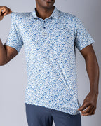 Pins & Aces Signal Boost men’s performance golf polo featuring an athletic fit with breathable fast-wicking fabric, SPF 45+ protection, and built-in sunglasses holder.
