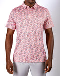 Men’s Soft Spoken golf polo by Pins & Aces featuring a subtle coral, red, navy, and white micro floral print with short sleeves and an athletic performance fit.