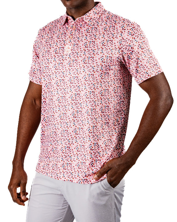 Men’s Soft Spoken golf polo by Pins & Aces featuring a subtle coral, red, navy, and white micro floral print with short sleeves and an athletic performance fit.