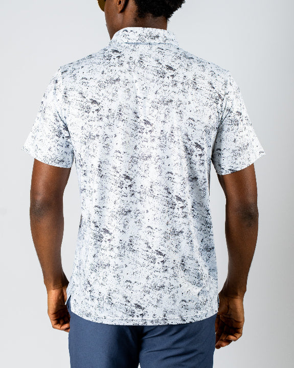 Men’s White Noise golf polo by Pins & Aces featuring a subtle white and gray abstract pattern, short sleeves, and an athletic performance fit.