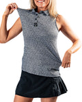 Pins & Aces Women’s Coral Cascades performance golf polo featuring a women’s athletic fit with fast-wicking fabric, SPF 45+ protection and a built-in sunglasses holder.