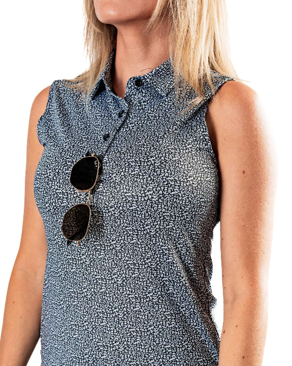Pins & Aces Women’s Coral Cascades performance golf polo featuring a women’s athletic fit with fast-wicking fabric, SPF 45+ protection and a built-in sunglasses holder.