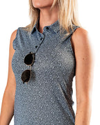 Pins & Aces Women’s Coral Cascades performance golf polo featuring a women’s athletic fit with fast-wicking fabric, SPF 45+ protection and a built-in sunglasses holder.