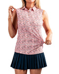 Women’s Soft Spoken golf polo by Pins & Aces featuring a sleeveless collared design with an all-over coral, pink, gray, and black micro floral print and athletic performance fit.