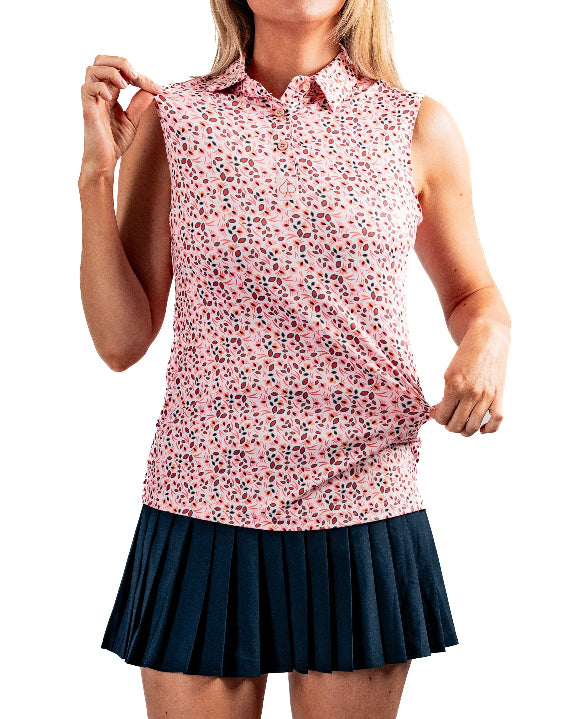 Women’s Soft Spoken golf polo by Pins & Aces featuring a sleeveless collared design with an all-over coral, pink, gray, and black micro floral print and athletic performance fit.