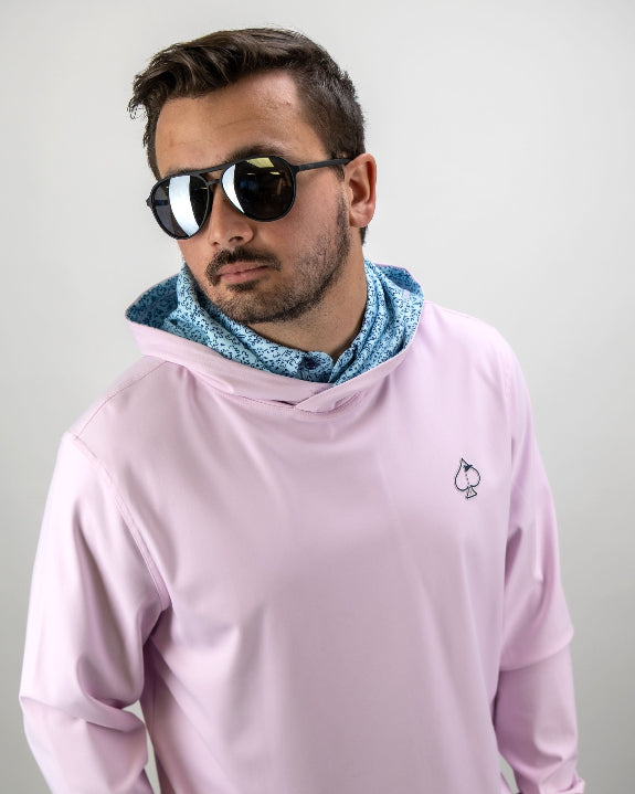 Men’s Flower Doodle Blue performance golf hoodie by Pins & Aces featuring a light pink body, blue floral doodle printed hood interior, embroidered spade logo, and long sleeves.