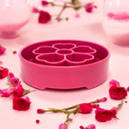 SodaPup Flower eBowl deep slow feeder dog bowl with flower-shaped enrichment ridges, available in pink or purple for medium and large dogs.