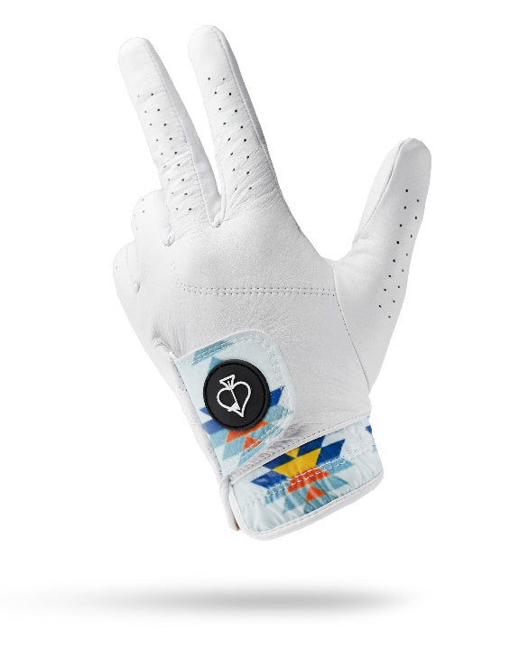 White Pins & Aces Southwest Sunset Premium Tour golf glove made from Cabretta leather with perforated fingers and a colorful Southwest-inspired wrist design.