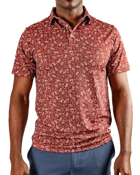 Men’s Autumn Bloom golf polo by Pins & Aces featuring a rust-colored all-over cream floral print, short sleeves, blade collar, and athletic performance fit.