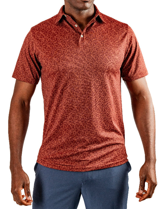 Men’s Filament golf polo by Pins & Aces featuring a rust and burnt orange abstract line pattern, short sleeves, modern blade collar, and athletic performance fit.