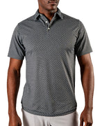 Men’s Jade Drops golf polo by Pins & Aces featuring a dark jade green geometric pattern, modern blade collar, short sleeves, and athletic performance fit.