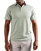 Men’s Origami Player Preferred golf polo by Pins & Aces featuring a sage green tonal geometric pattern, blade collar, short sleeves, and athletic performance fit.