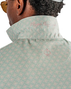 Men’s Origami Player Preferred golf polo by Pins & Aces featuring a sage green tonal geometric pattern, blade collar, short sleeves, and athletic performance fit.