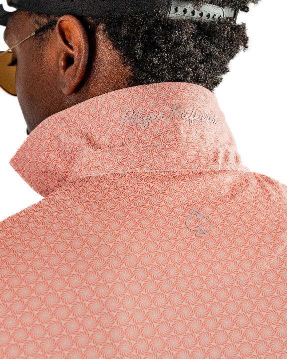 Men’s Phoenix Whirl golf polo by Pins & Aces featuring a bold swirling colorful print, modern blade collar, short sleeves, and athletic performance fit.
