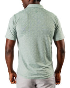 Men’s Pineapples Player Preferred golf polo by Pins & Aces featuring a sage green tonal pineapple print, blade collar, short sleeves, and athletic performance fit.