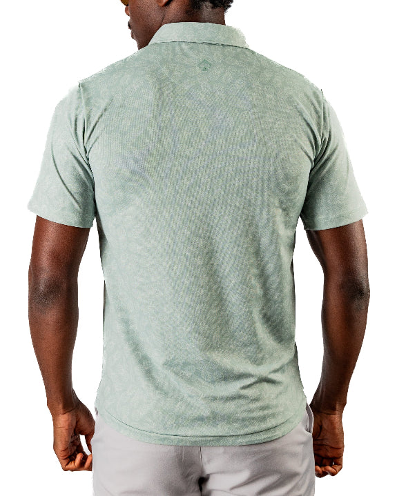 Men’s Pineapples Player Preferred golf polo by Pins & Aces featuring a sage green tonal pineapple print, blade collar, short sleeves, and athletic performance fit.