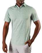 Men’s Pineapples Player Preferred golf polo by Pins & Aces featuring a sage green tonal pineapple print, blade collar, short sleeves, and athletic performance fit.