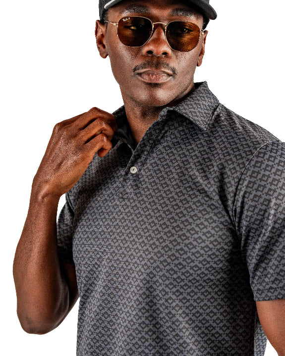 Men’s Slate Mosaic Player Preferred golf polo by Pins & Aces featuring a slate gray geometric pattern, modern blade collar, short sleeves, and athletic performance fit.