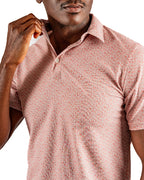 Men’s Sparrows Player Preferred golf polo by Pins & Aces featuring a coral and cream micro-pattern, blade collar, short sleeves, and athletic performance fit.