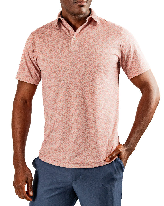Men’s Sparrows Player Preferred golf polo by Pins & Aces featuring a coral and cream micro-pattern, blade collar, short sleeves, and athletic performance fit.