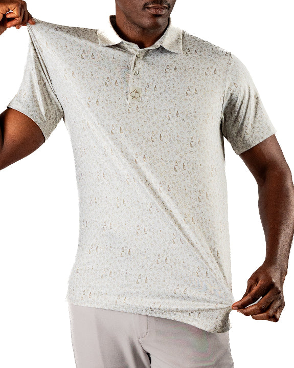 Men’s Drinking Buddies golf polo by Pins & Aces featuring a subtle drinking-inspired all-over print on a cream short-sleeve performance polo with an athletic fit.