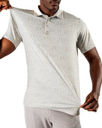 Men’s Drinking Buddies golf polo by Pins & Aces featuring a subtle drinking-inspired all-over print on a cream short-sleeve performance polo with an athletic fit.