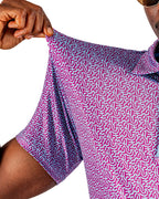 Men’s Sugar Circuit golf polo by Pins & Aces featuring a vibrant pink, purple, and blue geometric all-over pattern with short sleeves and an athletic performance fit.
