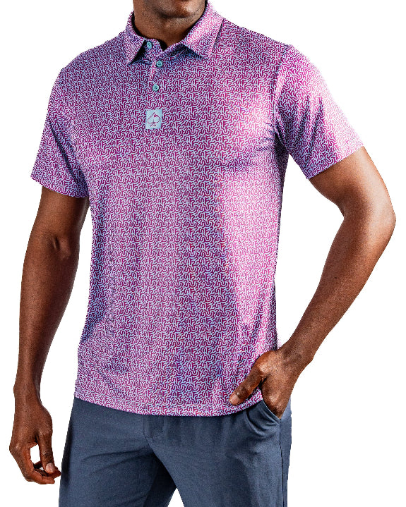 Men’s Sugar Circuit golf polo by Pins & Aces featuring a vibrant pink, purple, and blue geometric all-over pattern with short sleeves and an athletic performance fit.