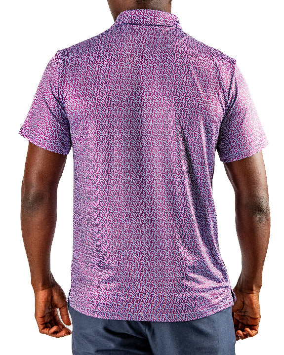 Men’s Sugar Circuit golf polo by Pins & Aces featuring a vibrant pink, purple, and blue geometric all-over pattern with short sleeves and an athletic performance fit.