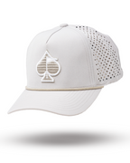 Bone off-white perforated rope golf hat by Pins & Aces featuring breathable perforated panels, braided rope detail, adjustable snapback, and built-in magnetic golf ball marker holder.