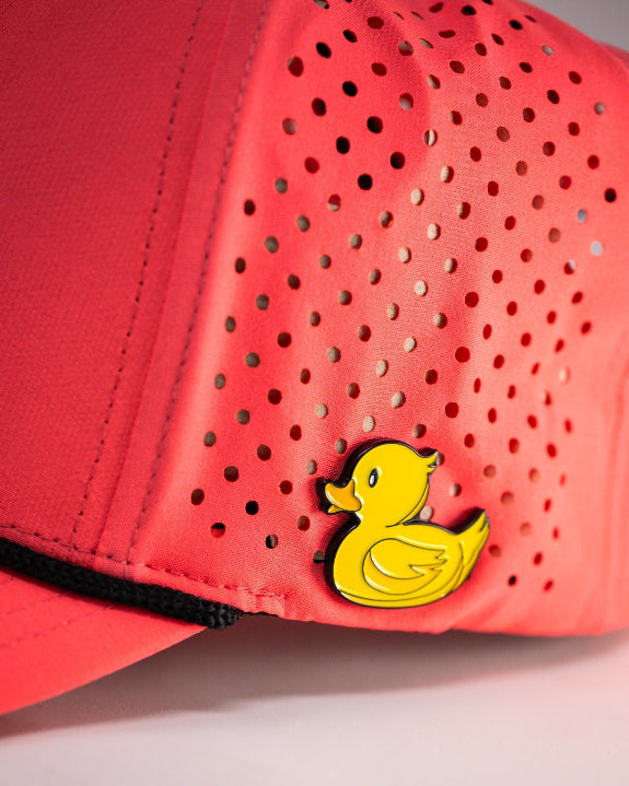 Highlighter pink perforated rope golf hat by Pins & Aces featuring an embroidered Fairway Wave Spade logo, adjustable snapback, and built-in magnetic golf ball marker holder.