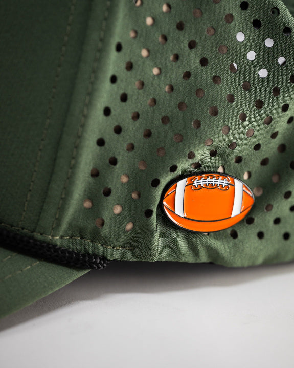 Olive green perforated rope golf hat by Pins & Aces featuring an embroidered Fairway Wave Spade logo, rope accent, adjustable snapback, and built-in magnetic golf ball marker holder.