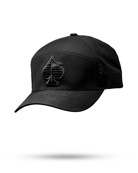 Tradesman Black golf hat by Pins & Aces featuring structured 6-panel construction, adjustable snapback closure, and a built-in magnetic golf ball marker holder.