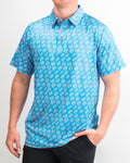 Men’s Skyline Dash Blue golf polo by Pins & Aces featuring a bright blue geometric dash pattern with pink accents and an athletic performance fit.