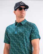 Men’s Chromo Green performance golf polo by Pins & Aces featuring an all-over green, blue, and yellow diagonal geometric stripe pattern with short sleeves and an athletic fit.
