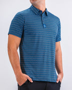 Men’s Rising Tides golf polo by Pins & Aces featuring a repeating blue and navy wave-inspired pattern, short sleeves, and an athletic performance fit.