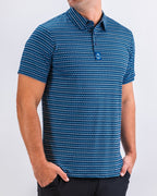 Men’s Rising Tides golf polo by Pins & Aces featuring a repeating blue and navy wave-inspired pattern, short sleeves, and an athletic performance fit.