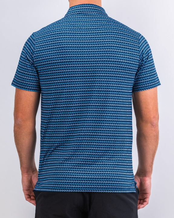 Men’s Rising Tides golf polo by Pins & Aces featuring a repeating blue and navy wave-inspired pattern, short sleeves, and an athletic performance fit.