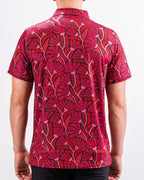 Men’s Garden Party Crimson Bloom golf polo by Pins & Aces featuring an oversized crimson, red, pink, and burgundy floral print with short sleeves and an athletic performance fit.