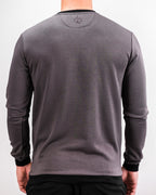 Men’s Player Preferred™ Slate Grey performance golf crewneck by Pins & Aces featuring a classic crew neckline, long sleeves, elastic cuffs and waist, and a tailored course-to-clubhouse fit.