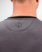 Men’s Player Preferred™ Slate Grey performance golf crewneck by Pins & Aces featuring a classic crew neckline, long sleeves, elastic cuffs and waist, and a tailored course-to-clubhouse fit.