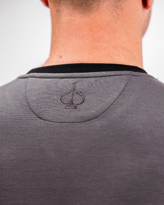 Men’s Player Preferred™ Slate Grey performance golf crewneck by Pins & Aces featuring a classic crew neckline, long sleeves, elastic cuffs and waist, and a tailored course-to-clubhouse fit.